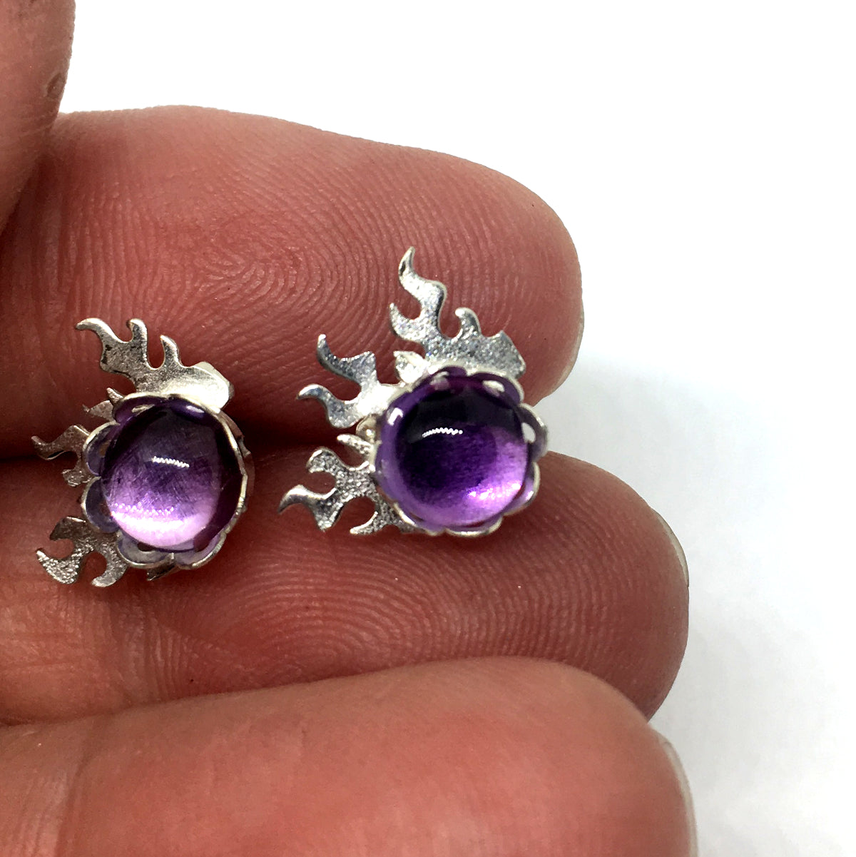 6mm round amethyst are bezel set